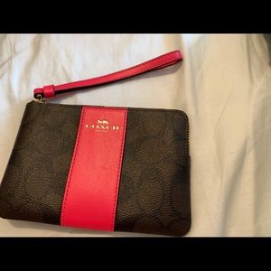 Brown and pink coach wristlet